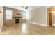 Open living room with fireplace and tile floors at 10550 W Alexander Rd # 1156, Las Vegas, NV 89129