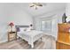 Cozy bedroom with natural light, a ceiling fan, and an ensuite bathroom at 10725 Sky Meadows Ave, Las Vegas, NV 89134