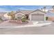 Charming single-story home with landscaped front yard and attached two-car garage at 10725 Sky Meadows Ave, Las Vegas, NV 89134