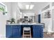 Well-lit kitchen with a marble countertop island and stainless steel appliances at 10725 Sky Meadows Ave, Las Vegas, NV 89134