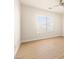 Well-lit bedroom featuring wood flooring and a window at 1086 Sheer Paradise Ln # 101, Henderson, NV 89002