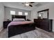 Main bedroom with dark wood furniture and hardwood floors at 1112 Via Monticano, Henderson, NV 89052