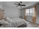 Bright bedroom with striped bedding and large window at 1112 Via Monticano, Henderson, NV 89052