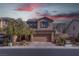 Two-story house with attached garage and solar panels at 1112 Via Monticano, Henderson, NV 89052