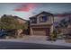 Two-story house with attached garage and landscaping at 1112 Via Monticano, Henderson, NV 89052