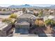 Aerial view of a two-story house and surrounding neighborhood at 1137 Glistening Point Ave, Henderson, NV 89015