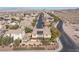 Two story house with solar panels and a pool in a desert residential area at 1137 Glistening Point Ave, Henderson, NV 89015