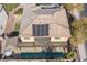 Two-story house with solar panels, pool, and pergola, viewed from above at 1137 Glistening Point Ave, Henderson, NV 89015