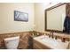 Small bathroom with single sink, decorative tile, and mirror at 1137 Glistening Point Ave, Henderson, NV 89015