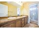 Bathroom with double sinks, granite countertops, and a shower at 1137 Glistening Point Ave, Henderson, NV 89015