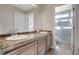 Bathroom with double sinks, granite countertops, and a shower at 1137 Glistening Point Ave, Henderson, NV 89015