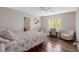Bedroom with a bed, desk, chair, and wood flooring at 1137 Glistening Point Ave, Henderson, NV 89015