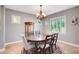 Formal dining room featuring a round table and wood floors at 1137 Glistening Point Ave, Henderson, NV 89015