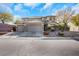 Two-story house with three car garage and landscaped yard at 1137 Glistening Point Ave, Henderson, NV 89015