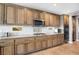 Large kitchen with granite countertops and wood cabinets at 1137 Glistening Point Ave, Henderson, NV 89015