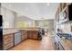 Modern kitchen with stainless steel appliances and an island at 1137 Glistening Point Ave, Henderson, NV 89015
