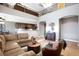 Spacious living room with high ceilings and a large sectional sofa at 1137 Glistening Point Ave, Henderson, NV 89015