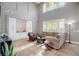 Open living area with built-in shelving and large windows at 1137 Glistening Point Ave, Henderson, NV 89015