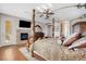 Main bedroom with fireplace and large bed at 1137 Glistening Point Ave, Henderson, NV 89015