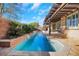 Long pool with a spa and a pergola-covered patio at 1137 Glistening Point Ave, Henderson, NV 89015