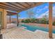 Backyard with a long pool, pergola, and patio at 1137 Glistening Point Ave, Henderson, NV 89015