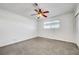 Bright bedroom featuring ceiling fan and neutral carpeting at 1401 S 17Th St, Las Vegas, NV 89104