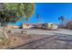 Ranch style home with a large front yard, long driveway and mature trees at 1401 S 17Th St, Las Vegas, NV 89104