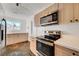 Modern kitchen with stainless steel appliances and light wood cabinets at 1401 S 17Th St, Las Vegas, NV 89104