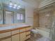 Clean bathroom with tub shower and wood vanity at 1409 Santa Margarita St # G, Las Vegas, NV 89146