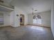 Spacious living room with an arched window and view to kitchen at 1409 Santa Margarita St # G, Las Vegas, NV 89146