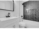 Modern bathroom with herringbone tile and white vanity at 1411 Norman Ave, Las Vegas, NV 89104