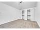 Well-lit bedroom with two closets and carpet flooring at 1411 Norman Ave, Las Vegas, NV 89104