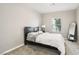 Guest bedroom with full-size bed and large mirror at 1557 Mistywood Ct, Henderson, NV 89014