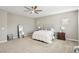 Well-lit bedroom with full-size bed and large mirror at 1557 Mistywood Ct, Henderson, NV 89014