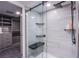 Modern bathroom with glass shower and built-in shelving at 205 E Harmon Ave # 1012, Las Vegas, NV 89169