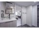 Modern bathroom with glass sink and walk-in shower at 205 E Harmon Ave # 1012, Las Vegas, NV 89169