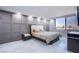 Spacious bedroom with large window, city view, and modern furniture at 205 E Harmon Ave # 1012, Las Vegas, NV 89169