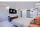 Bedroom with modern decor and large TV at 205 E Harmon Ave # 1012, Las Vegas, NV 89169