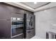 Sleek kitchen featuring stainless steel appliances and dark wood cabinets at 205 E Harmon Ave # 1012, Las Vegas, NV 89169