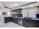 Modern kitchen with stainless steel appliances and dark wood cabinets at 205 E Harmon Ave # 1012, Las Vegas, NV 89169