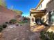 Landscaped backyard with grill and artificial turf at 2321 Martinique Ave, Henderson, NV 89044