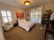 Cozy bedroom with a queen-size bed and access to a private balcony at 2321 Martinique Ave, Henderson, NV 89044