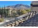 Community view with mountain backdrop and Spanish style homes at 2321 Martinique Ave, Henderson, NV 89044