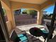 Relaxing covered patio with wicker furniture and a view of the backyard at 2321 Martinique Ave, Henderson, NV 89044