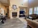 Bright living room with hardwood floors and a fireplace at 2321 Martinique Ave, Henderson, NV 89044