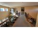 Elegant upstairs hallway overlooking the living area with wrought iron railings at 2321 Martinique Ave, Henderson, NV 89044