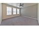 Primary bedroom with ceiling fan and grey accent wall at 2555 Hampton Rd # 3206, Henderson, NV 89052