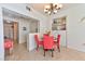 Charming dining area with built-in shelving and red chairs at 2555 Hampton Rd # 3206, Henderson, NV 89052