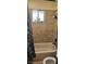 Bathroom with shower/tub combo and tiled walls at 2600 E Bonanza Rd, Las Vegas, NV 89101