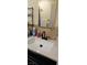 Bathroom with vanity sink, modern faucet, and dark brown cabinets at 2600 E Bonanza Rd, Las Vegas, NV 89101